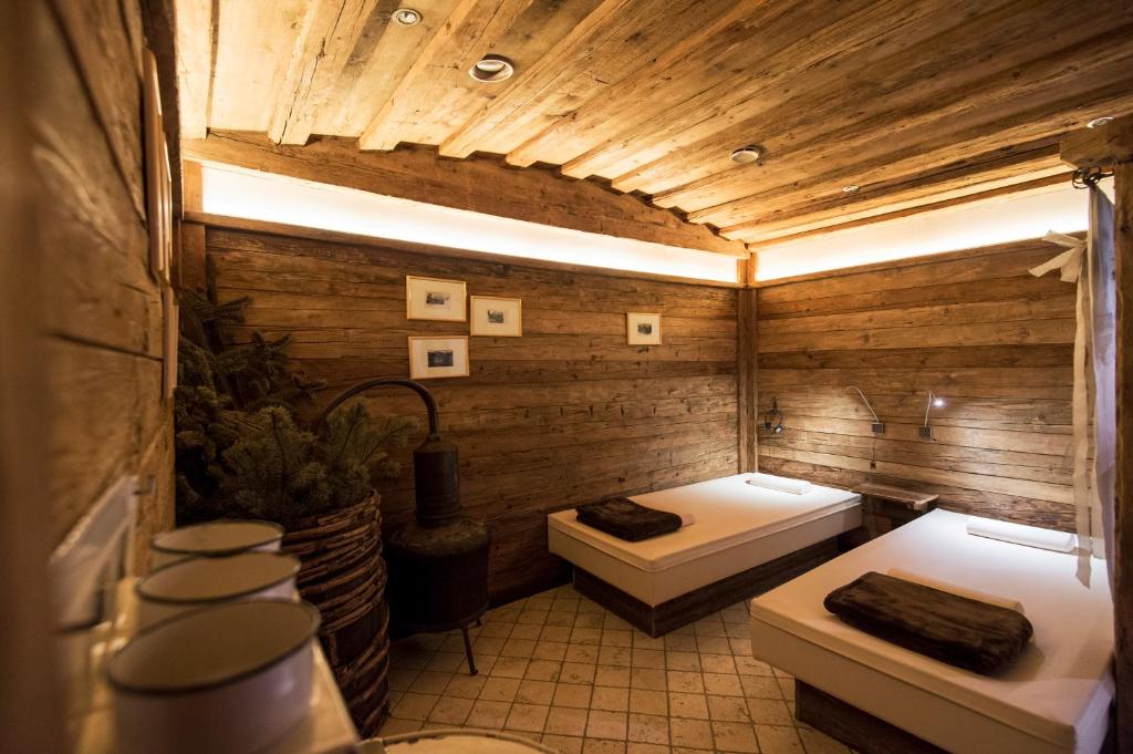 Postel nebo postele na pokoji v ubytování Charmehotel Uhrerhof - Deur