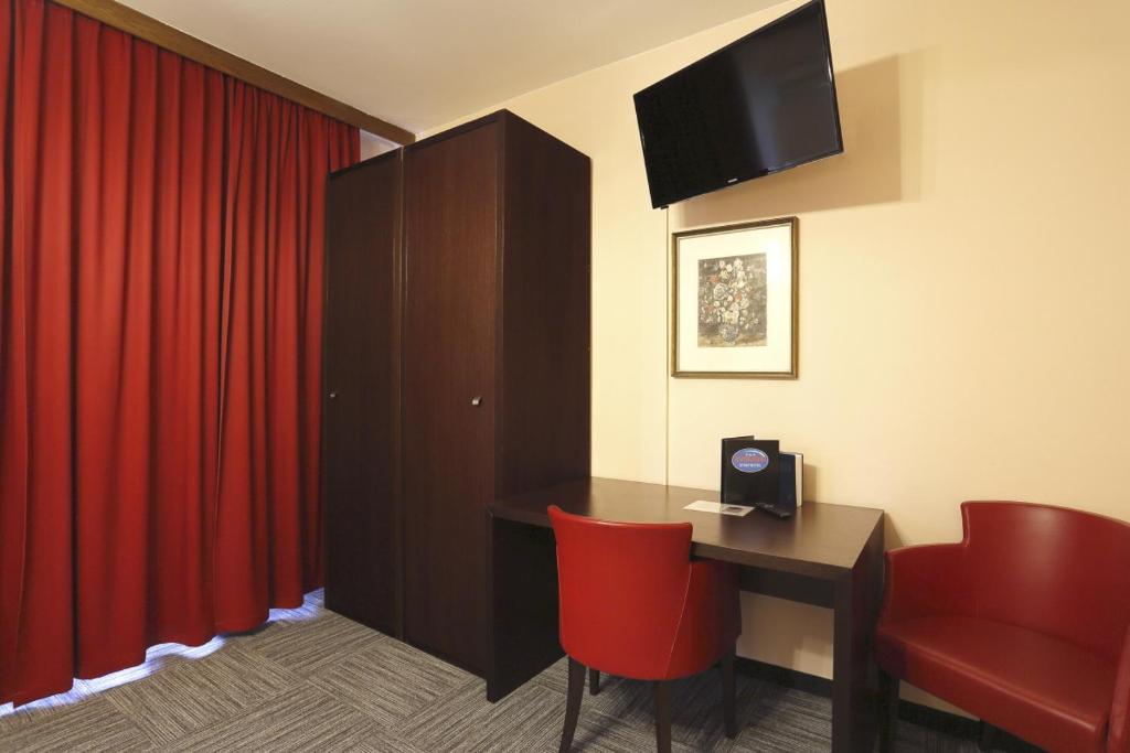 TV a/nebo společenská místnost v ubytování Alpen.Adria.Stadthotel
