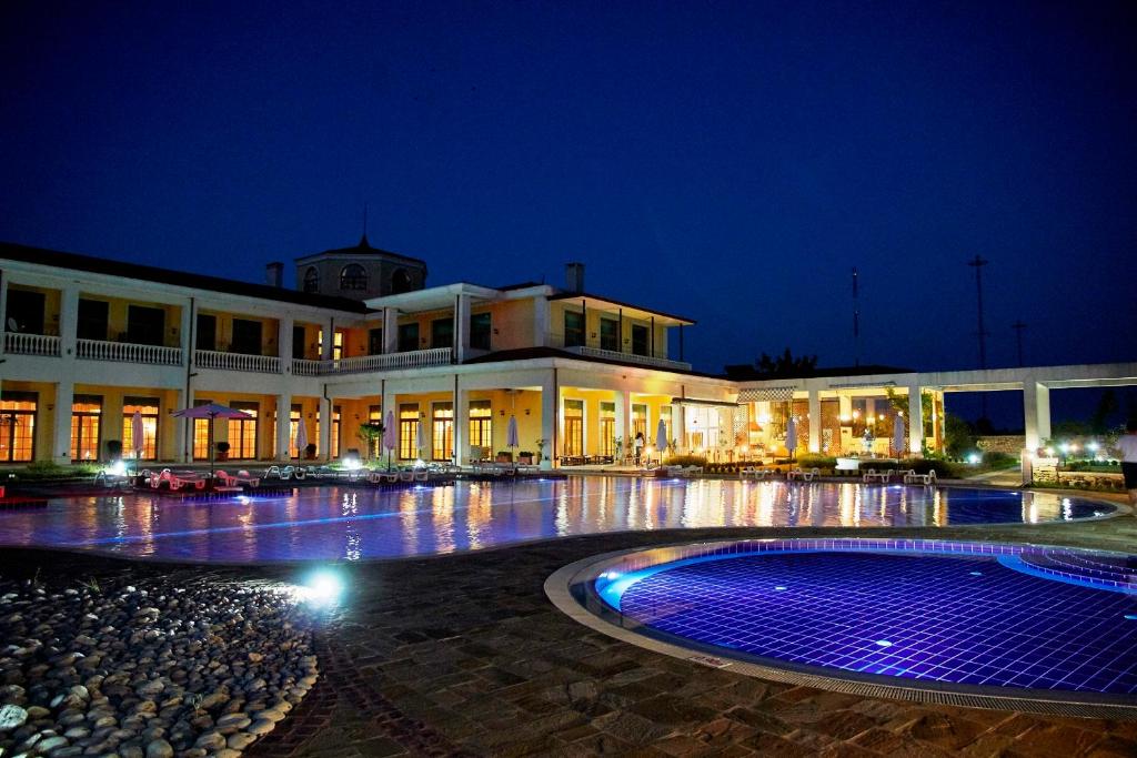 a large building with a lit up courtyard at night at Complex Villas Kaliakra & Gradina in Bŭlgarevo