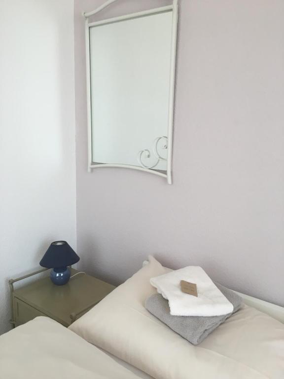 Postel nebo postele na pokoji v ubytování Hôtel de la Gare