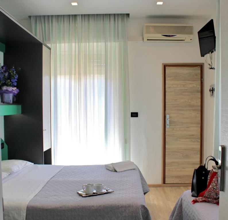 Postel nebo postele na pokoji v ubytování Hotel Tre Stelle