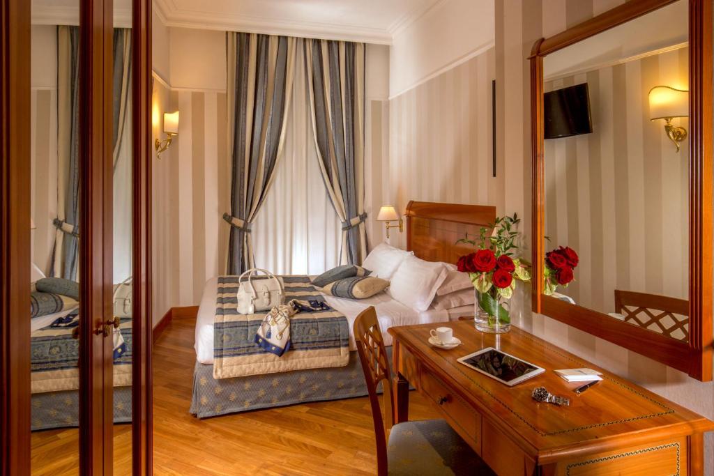 TV a/nebo společenská místnost v ubytování Albergo Ottocento