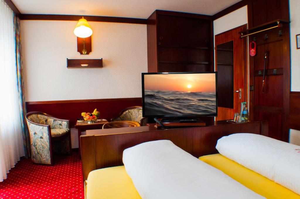Postel nebo postele na pokoji v ubytování Kurhotel Wiedenmann
