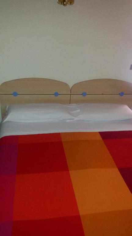 Postel nebo postele na pokoji v ubytování Albergo Luca