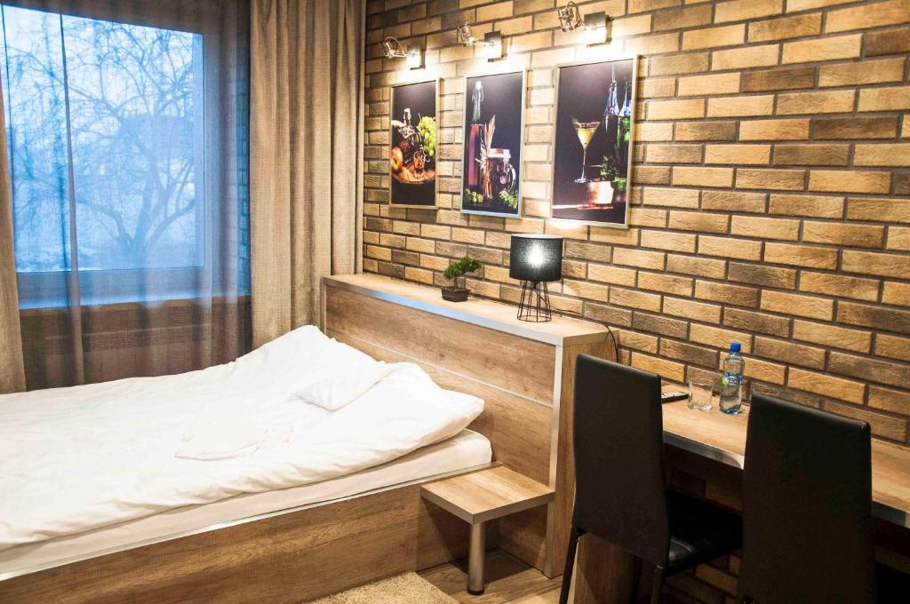 Ένα ή περισσότερα κρεβάτια σε δωμάτιο στο Motel Podmiejski