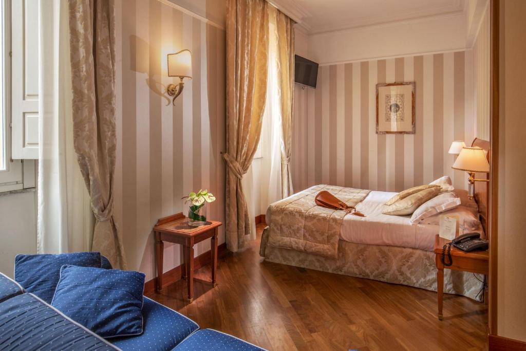 Postel nebo postele na pokoji v ubytování Albergo Ottocento