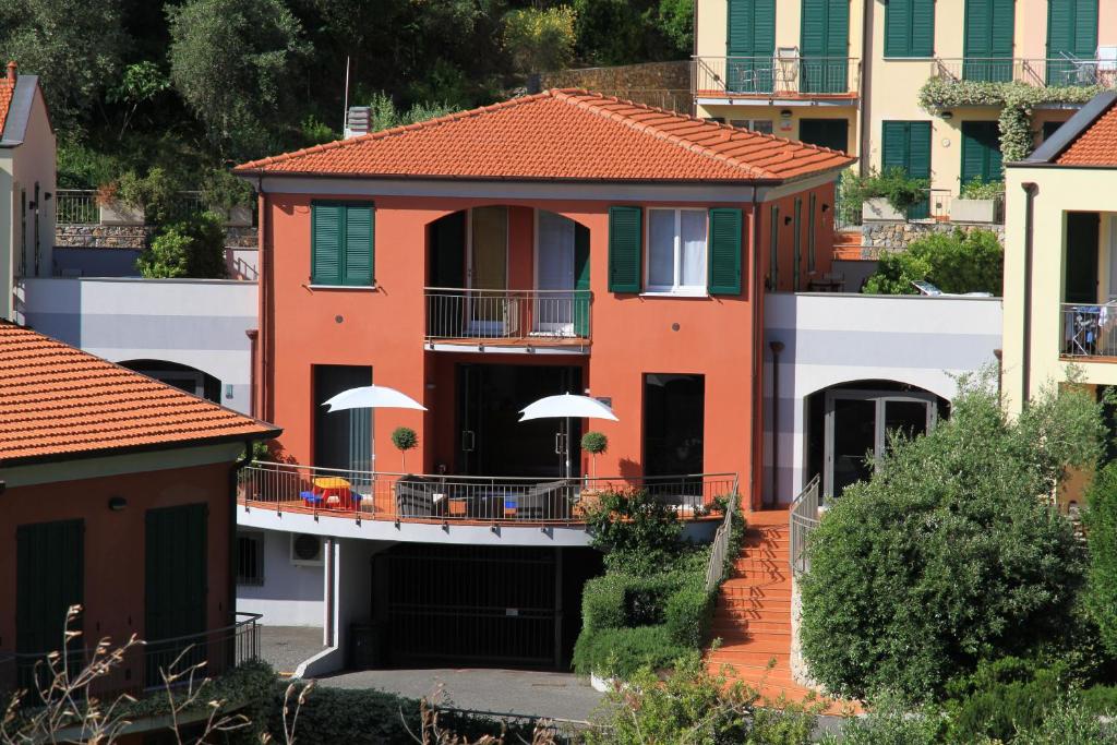 a house with a balcony in a city at Baia Blu RTA Residence in Lerici