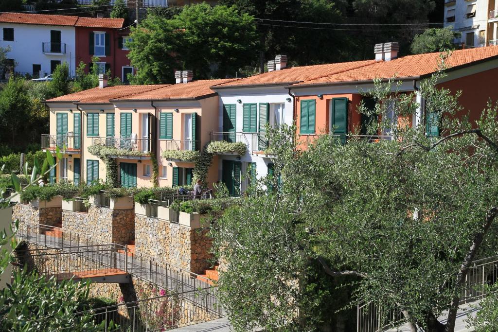 a row of houses on a hill at Baia Blu RTA Residence in Lerici