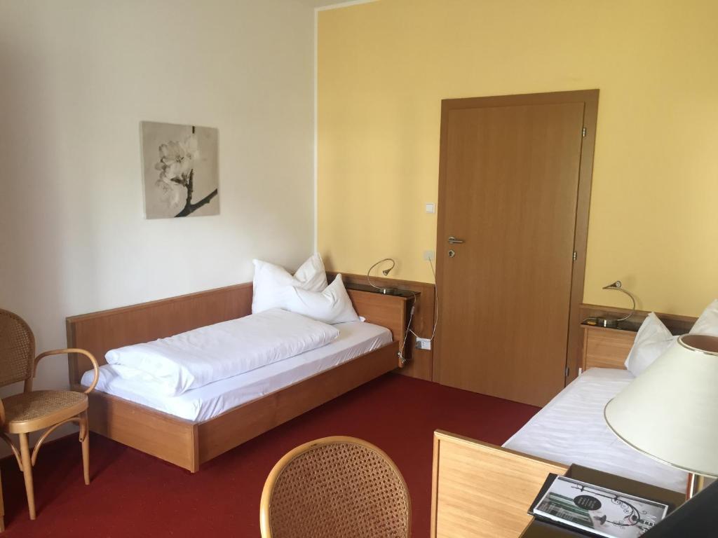 Postel nebo postele na pokoji v ubytování Hotel Zima