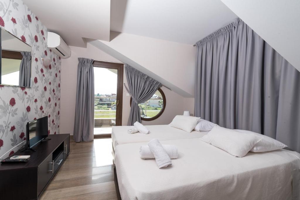 Postel nebo postele na pokoji v ubytování Principal New Leisure Hotel