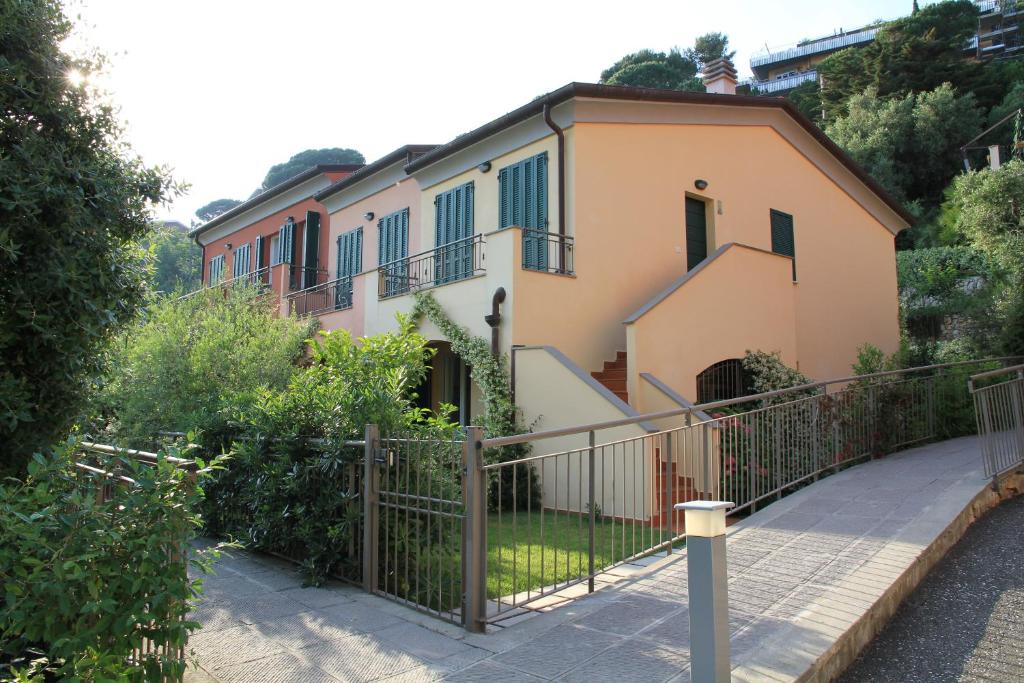 a house with a fence in front of it at Baia Blu RTA Residence in Lerici
