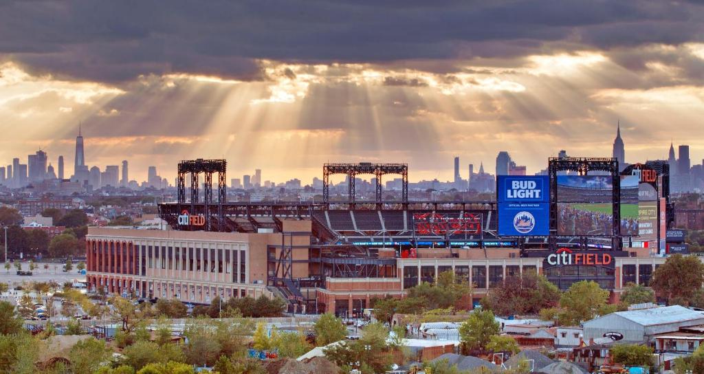 a view of a baseball stadium with the city in the background at The Parc Hotel in Queens