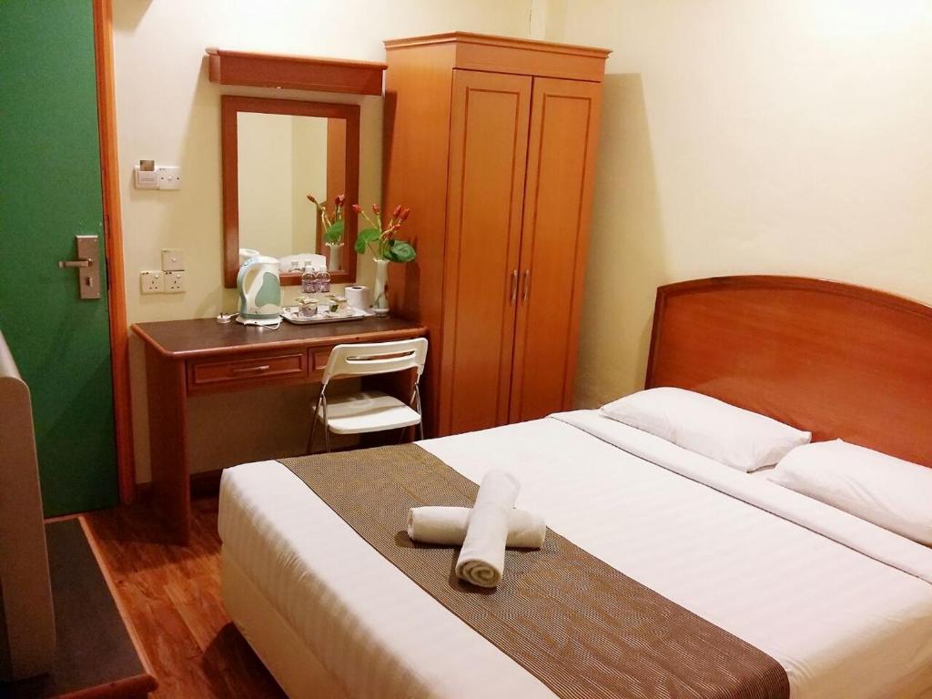 Postel nebo postele na pokoji v ubytování SkyGlobal Hotel