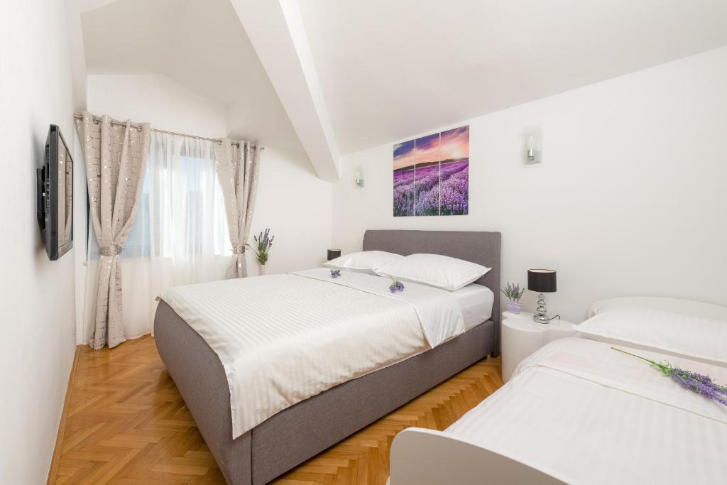 Posteľ alebo postele v izbe v ubytovaní Spalato Dream Apartmants