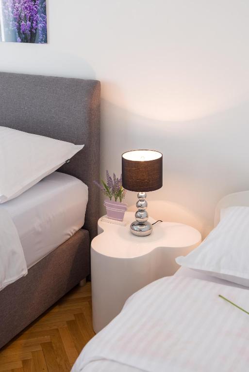 Posteľ alebo postele v izbe v ubytovaní Spalato Dream Apartmants