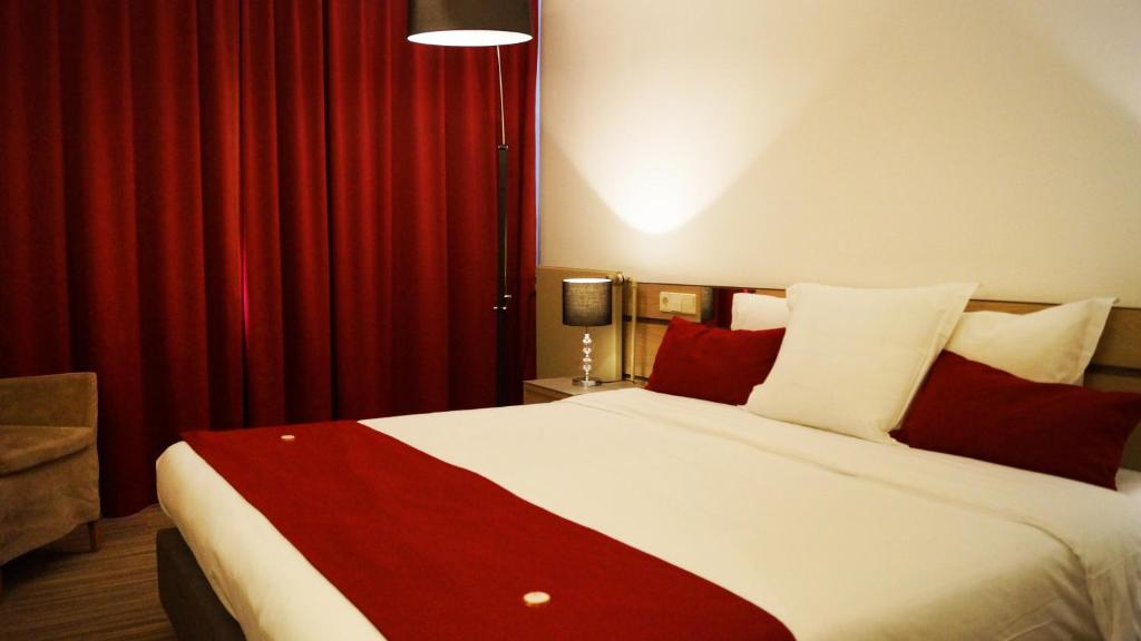 Voodi või voodid majutusasutuse Hotel Olivier toas