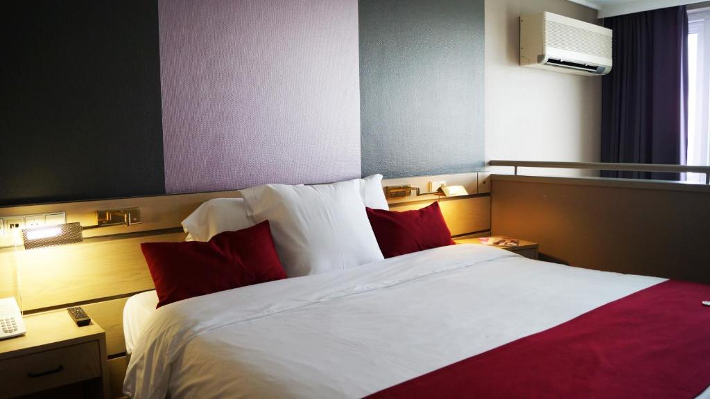 Voodi või voodid majutusasutuse Hotel Olivier toas
