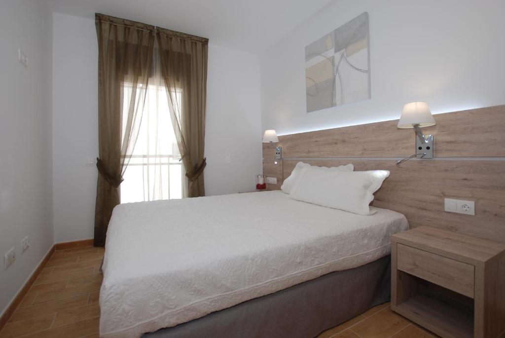 Giường trong phòng chung tại Apartments Gran VP