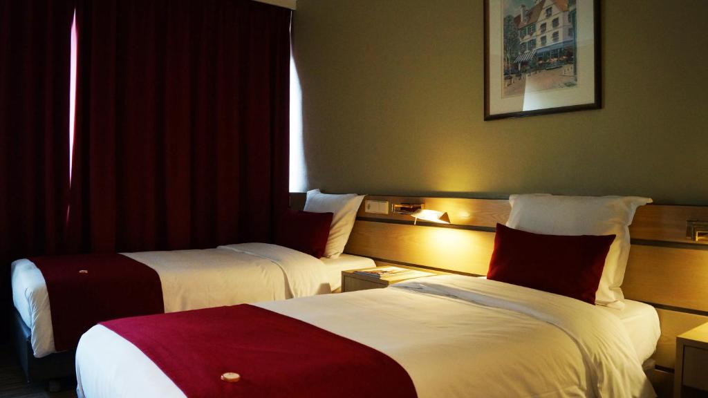 Voodi või voodid majutusasutuse Hotel Olivier toas