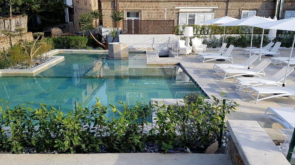Bazén v ubytování Artis Domus Relais & Spa nebo v jeho okolí