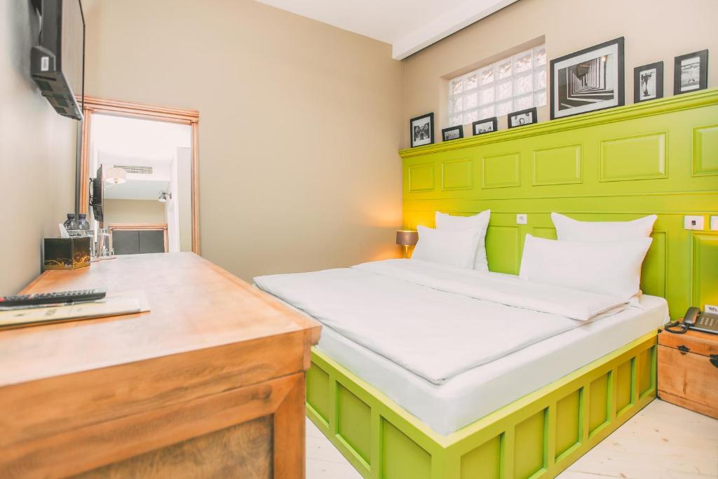 Postel nebo postele na pokoji v ubytování Kisi Boutique Hotel