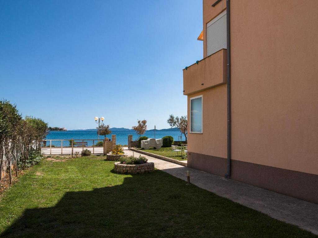 a view of the ocean from the side of a building at Apartments Nino 1 in Zadar