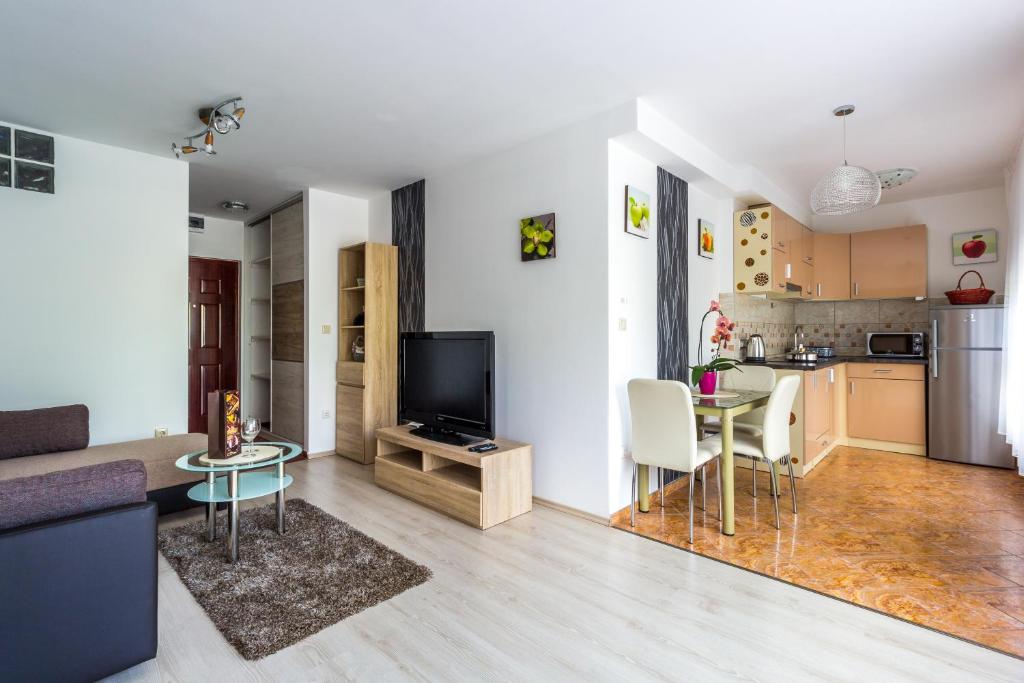 a living room with a couch and a table at Best Apartments Szeged in Szeged