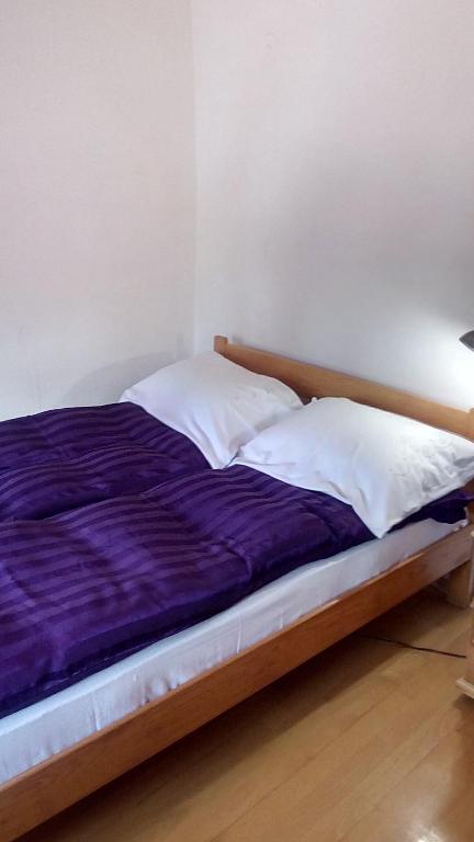 Postel nebo postele na pokoji v ubytování Guesthouse Nina