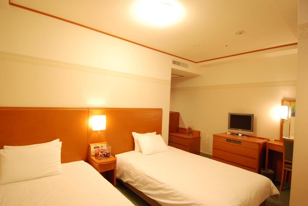 Postel nebo postele na pokoji v ubytování Hotel Tetora Otsu Kyoto