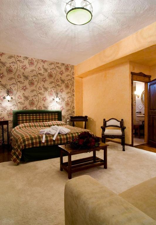 Postel nebo postele na pokoji v ubytování Hotel Polydrosos