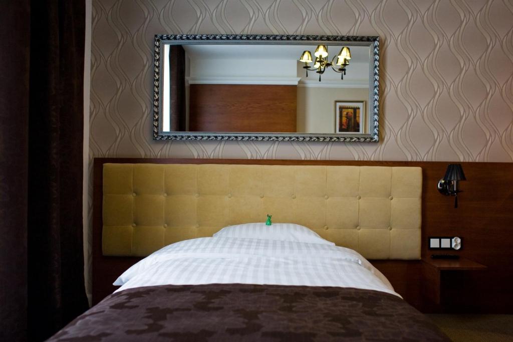 Postel nebo postele na pokoji v ubytování Hotel&Spa Kameleon