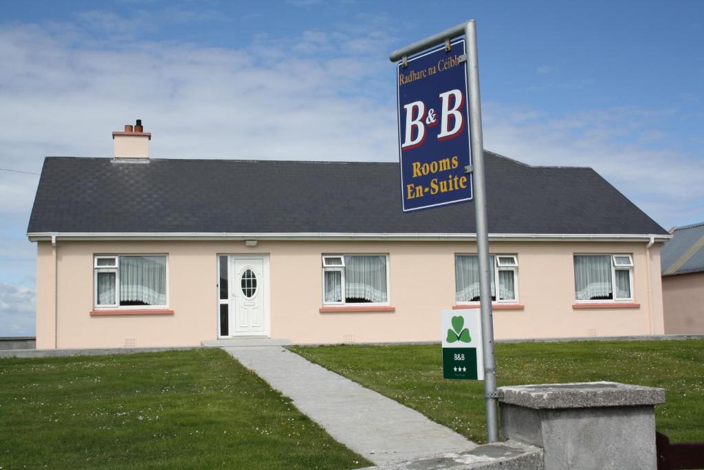 a house with a bbb sign in front of it at Radharc Na Ceibhe B&B H91 V0Y3 in Inis Mor