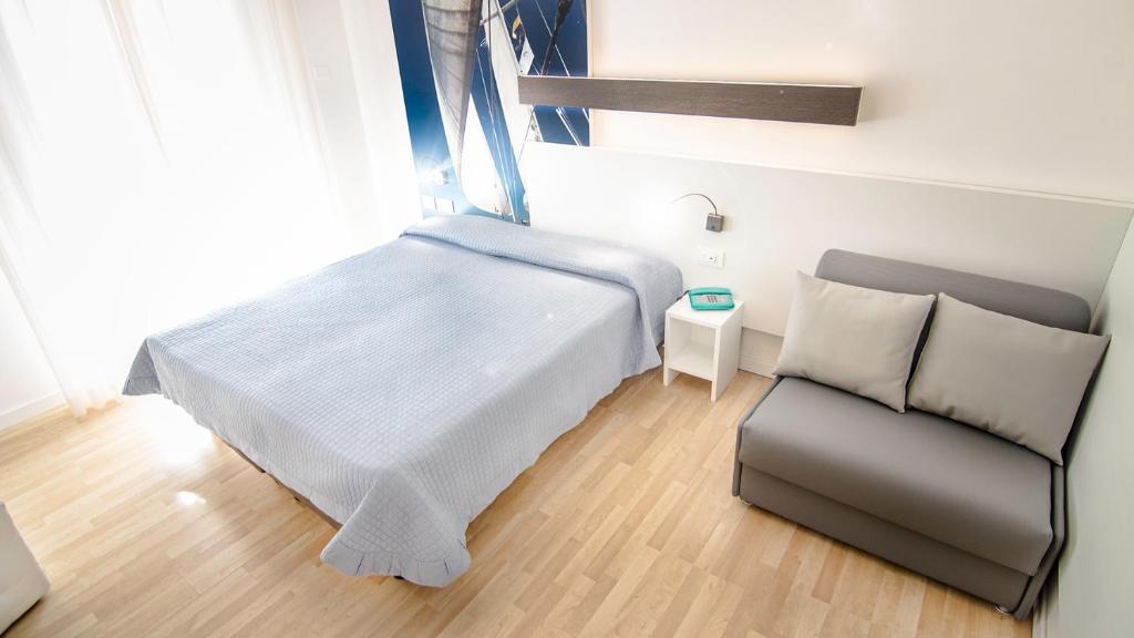 Postel nebo postele na pokoji v ubytování Hotel Antoniana