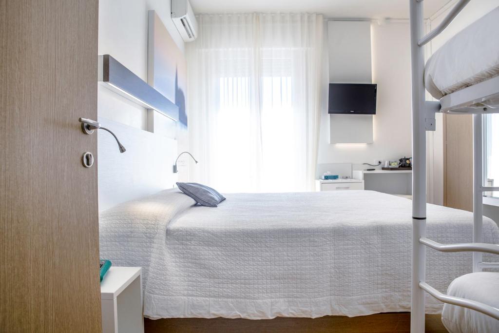 Postel nebo postele na pokoji v ubytování Hotel Antoniana