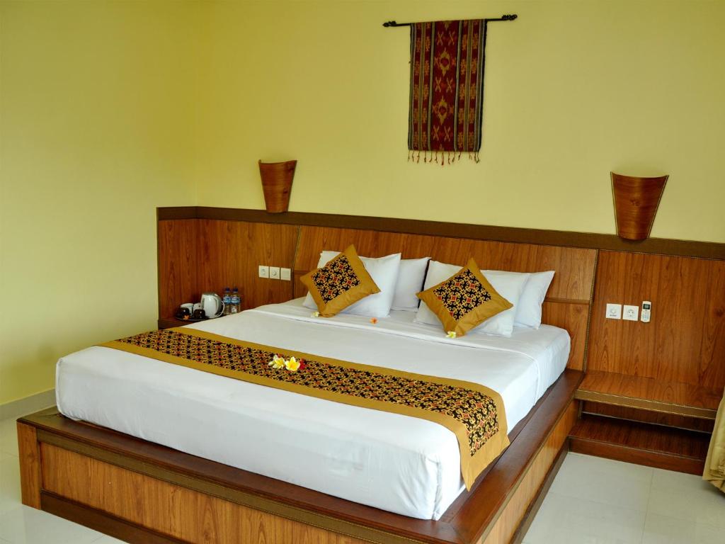 Postel nebo postele na pokoji v ubytování Bucu Guest House