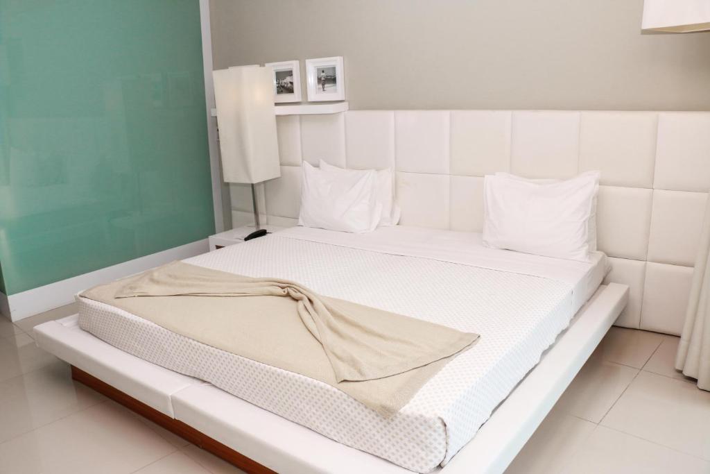 Postel nebo postele na pokoji v ubytování Hotel Vip Praia