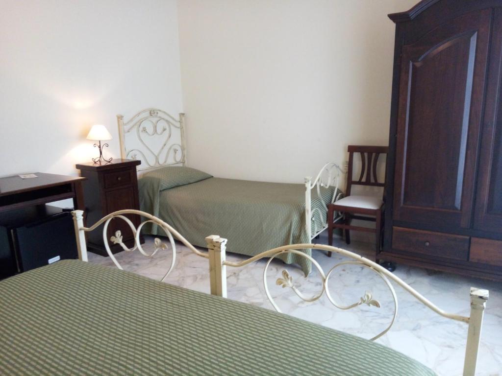 Posteľ alebo postele v izbe v ubytovaní Le Giare B&B
