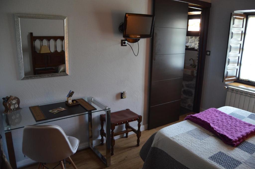 Postel nebo postele na pokoji v ubytování Posada Real La Montañesa