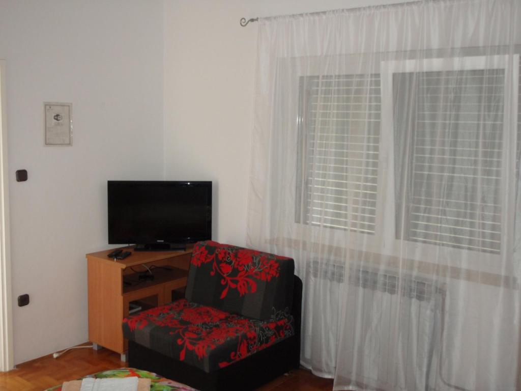 TV o dispositivi per l'intrattenimento presso Guest House Jasmin