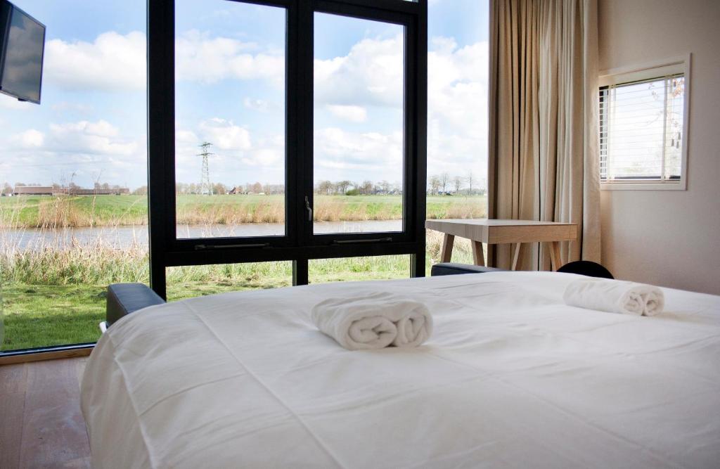 Postel nebo postele na pokoji v ubytování Hotel & Restaurant Weidumerhout