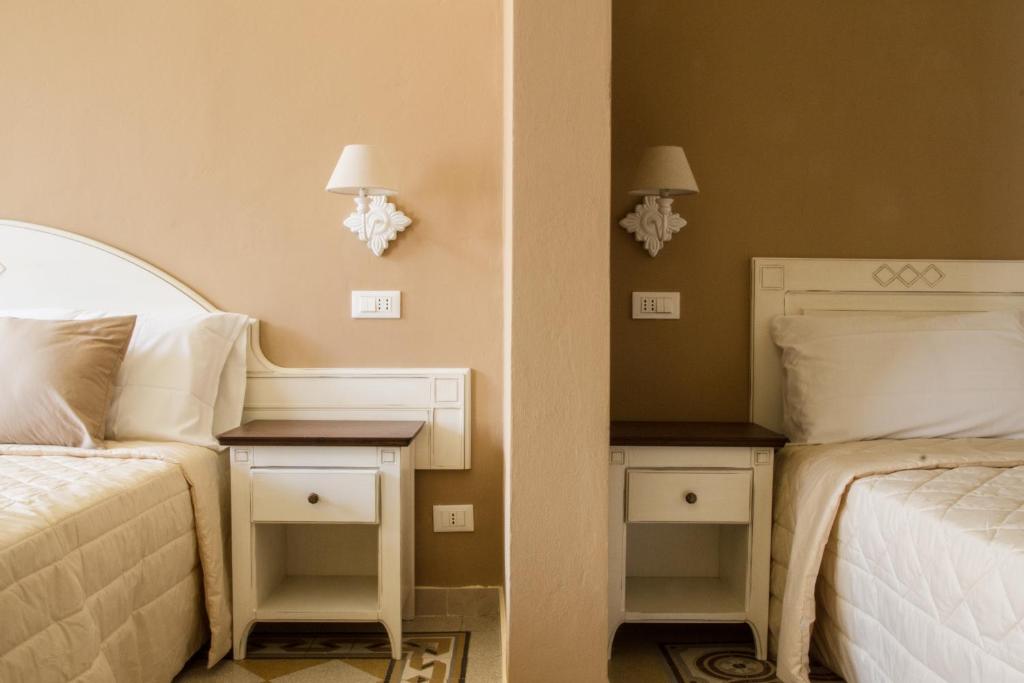Łóżko lub łóżka w pokoju w obiekcie Guest House Domo Florenzia