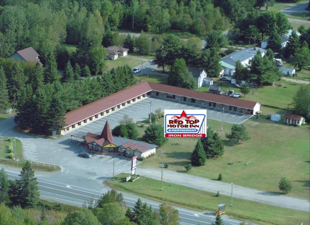 an overhead view of a large building with a sign at Red Top Motor Inn in Iron Bridge