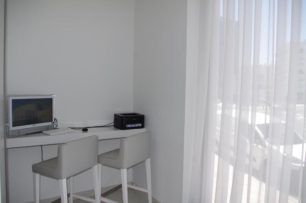 Телевизор и/или развлекательный центр в Kyriad Prestige Perpignan Centre Gare