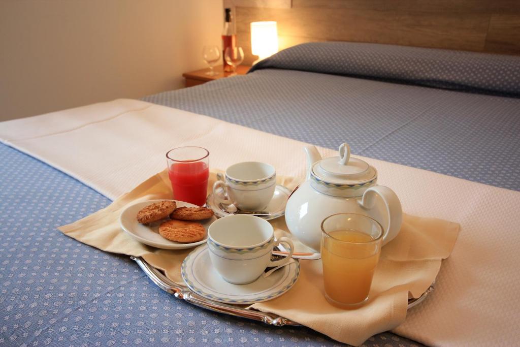 Postel nebo postele na pokoji v ubytování Hotel Colomber