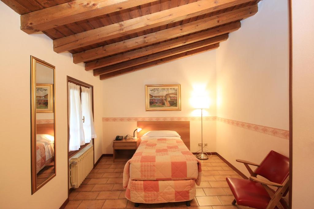 Postel nebo postele na pokoji v ubytování Hotel Colomber