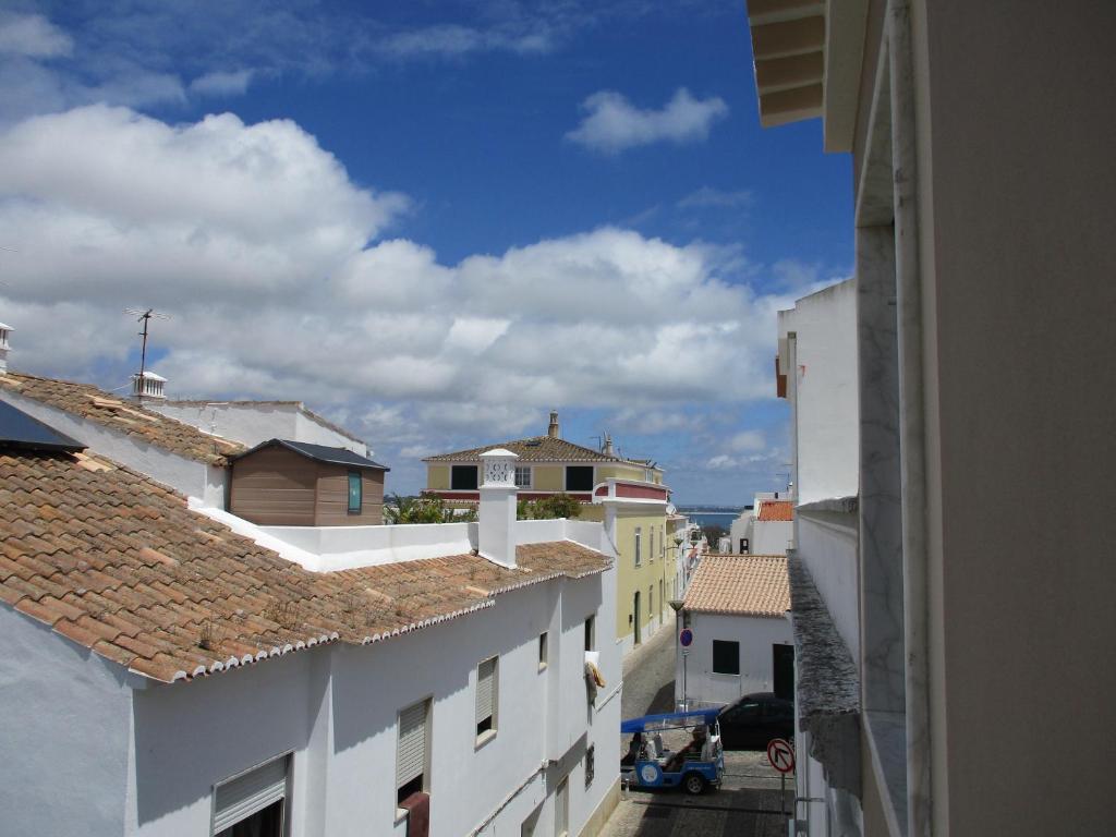 a view of the roofs of buildings in a city at Good Vibes - Lagos Guesthouse in Lagos