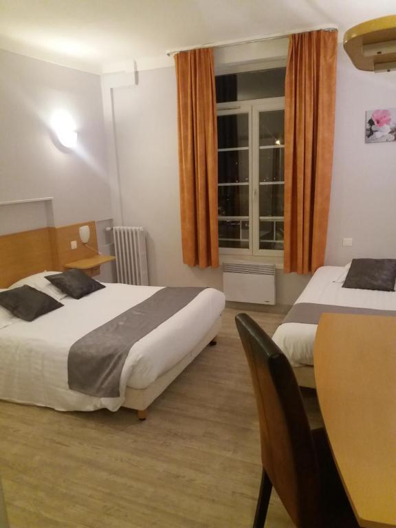Postel nebo postele na pokoji v ubytování L'Ecailler