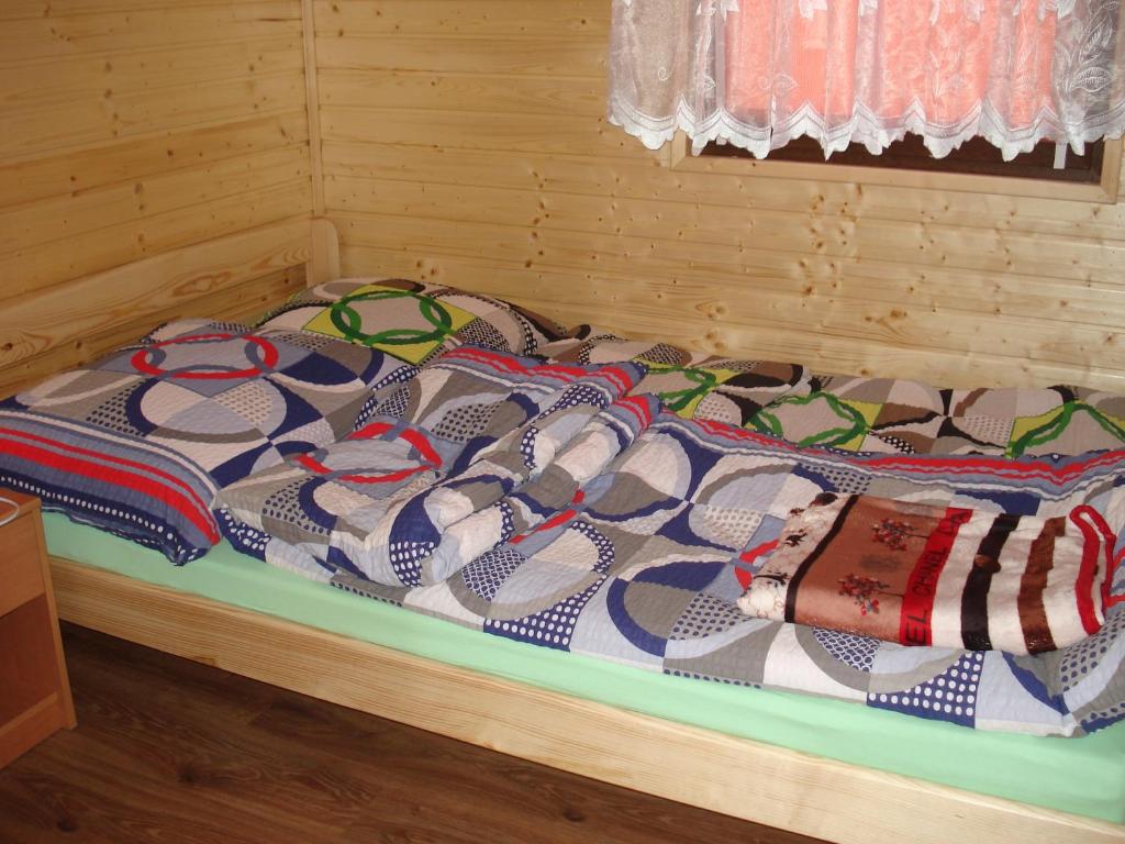 Postel nebo postele na pokoji v ubytování Ośrodek Wypoczynkowy "Słoneczko"