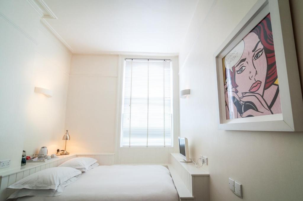 Letto o letti in una camera di Kellys Hotel