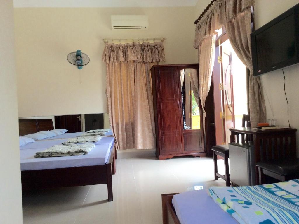 Quoc An Hotel - 阳台的家庭房